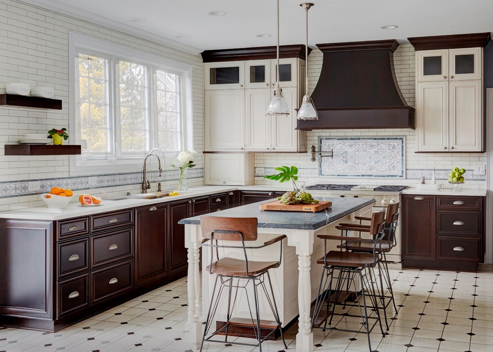 Inspiration for a large traditional l-shaped kitchen in Chicago with recessed-panel cabinets, soapstone benchtops, ceramic floors, with island, an undermount sink, beige cabinets, multi-coloured splashback, multi-coloured floor and white benchtop.