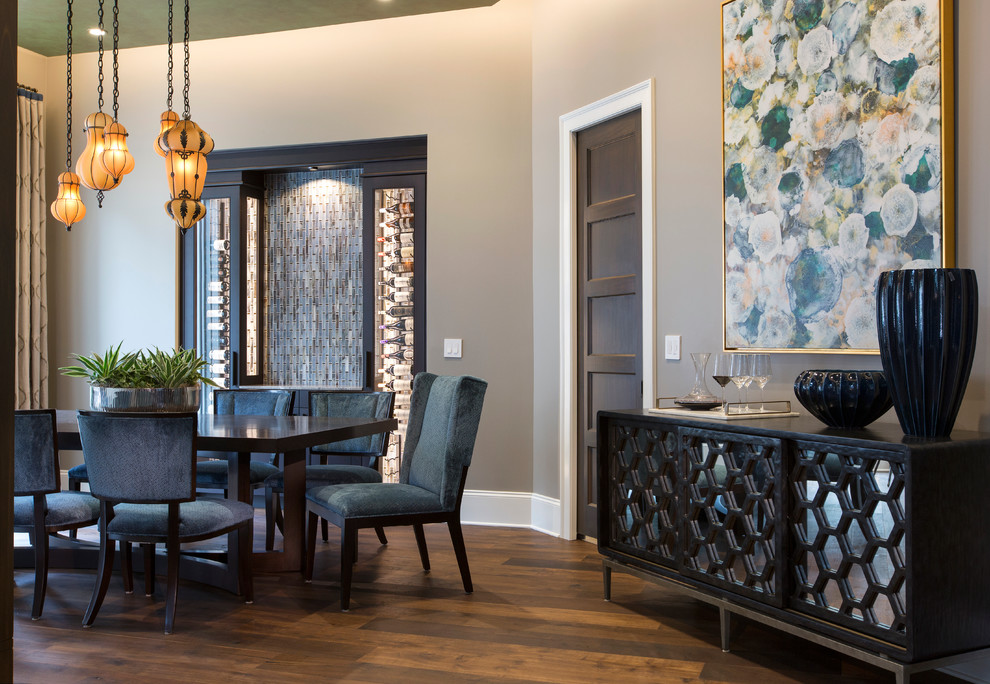 Photo of a mid-sized contemporary separate dining room in Jacksonville with grey walls, medium hardwood floors and no fireplace.