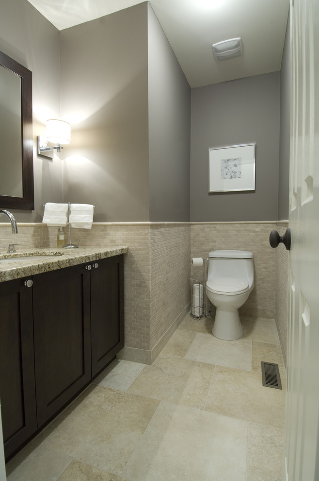 Photo of a traditional bathroom in Toronto with granite benchtops, stone tile and an undermount sink.