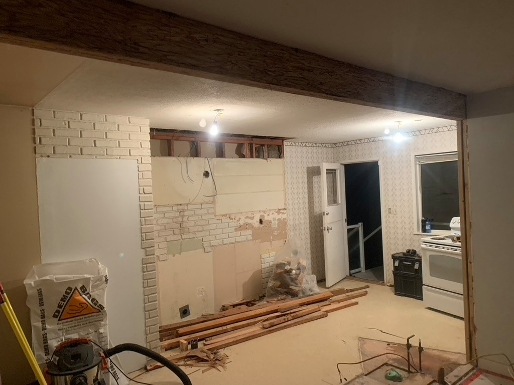 Remove wall and install beam. Install new kitchen.