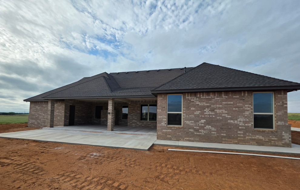 Covered patio has extended concrete for extra enjoyment