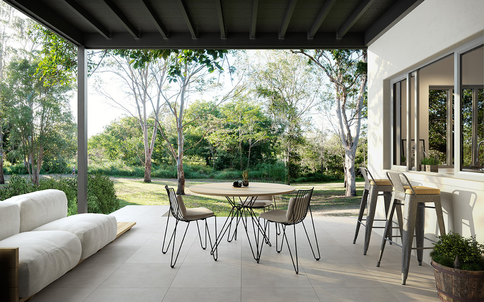 This is an example of a mid-sized contemporary patio in Brisbane with a pergola.