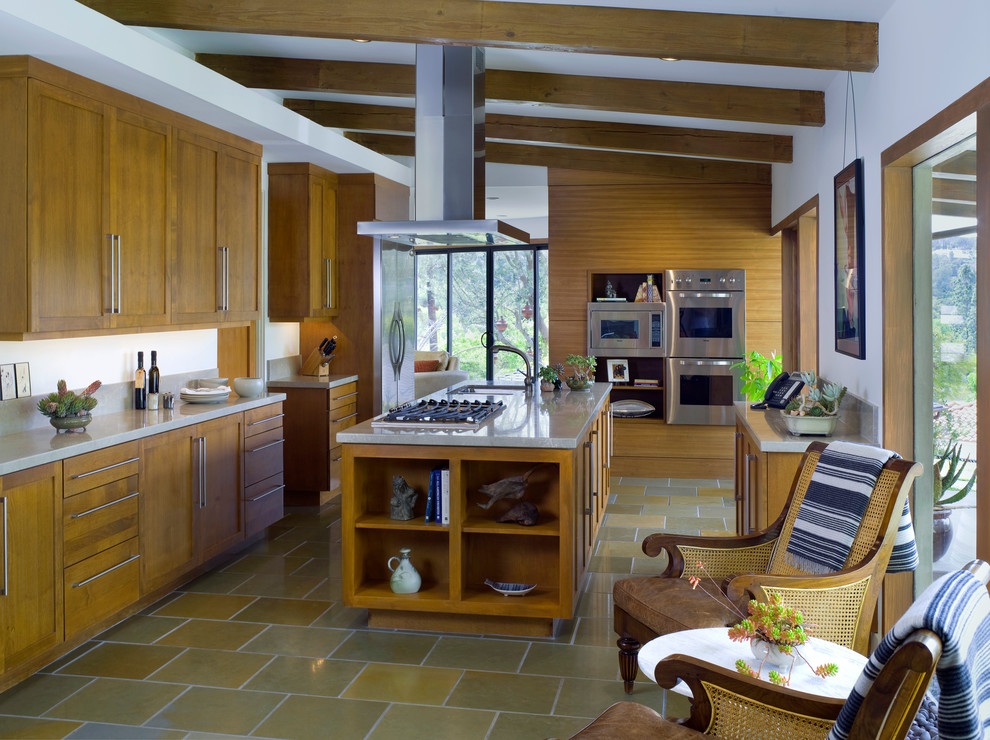 Design ideas for a midcentury kitchen in Santa Barbara with shaker cabinets, medium wood cabinets and stainless steel appliances.