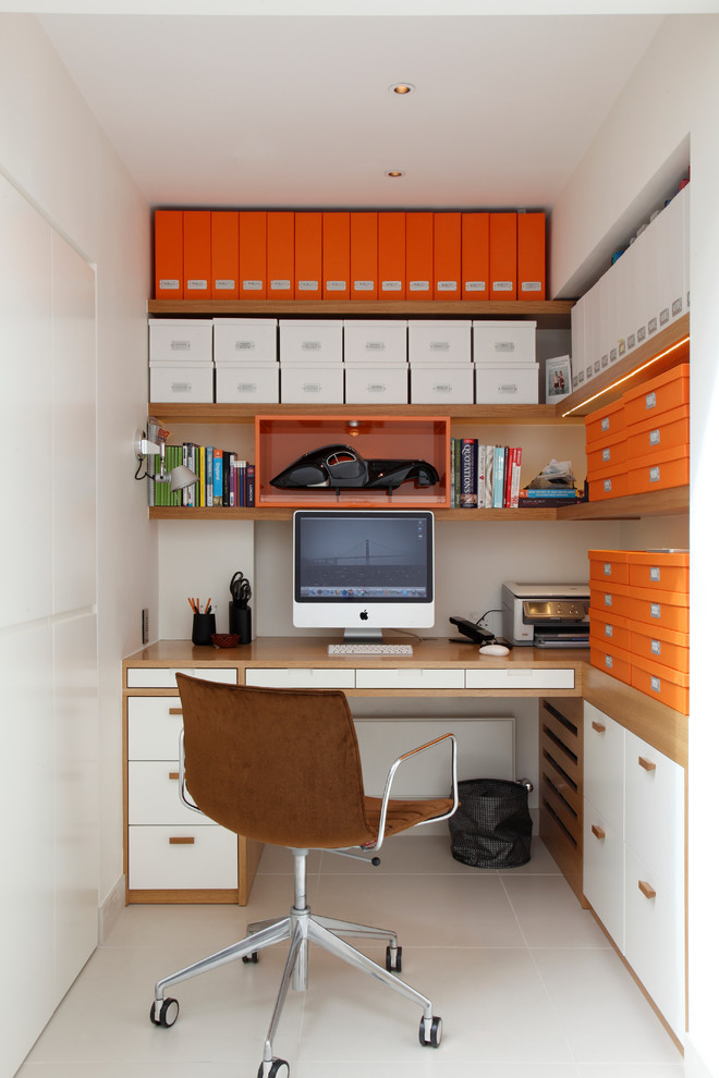 Photo of a small contemporary study room in London with white walls and a built-in desk.
