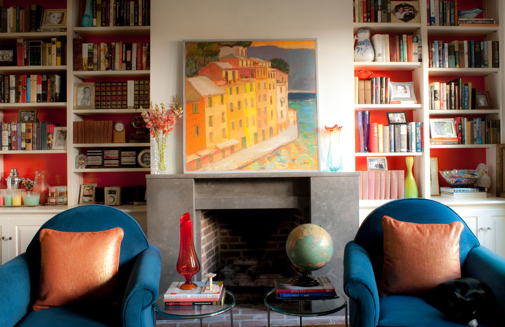 This is an example of an eclectic living room in Philadelphia with a library and a standard fireplace.