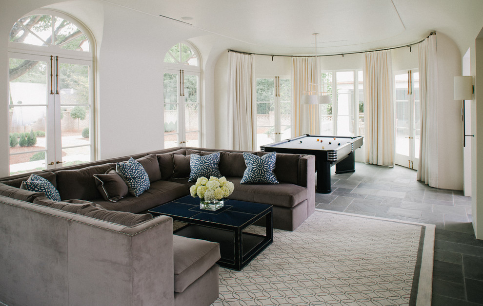 Example of a huge transitional slate floor game room design in Charlotte with white walls