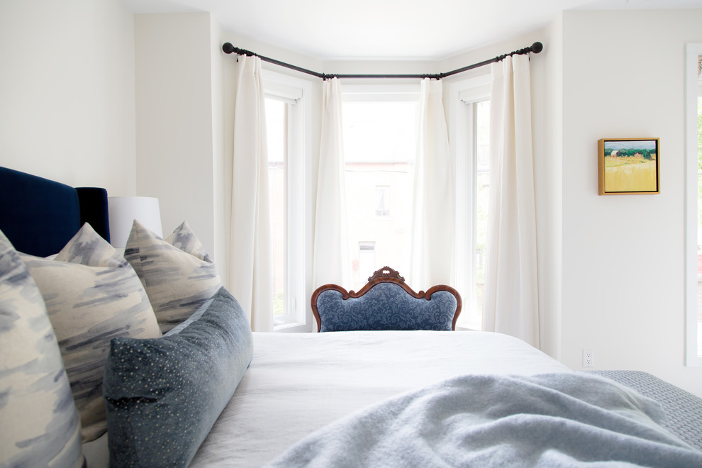 Example of a mid-sized transitional master dark wood floor and brown floor bedroom design in Toronto with white walls