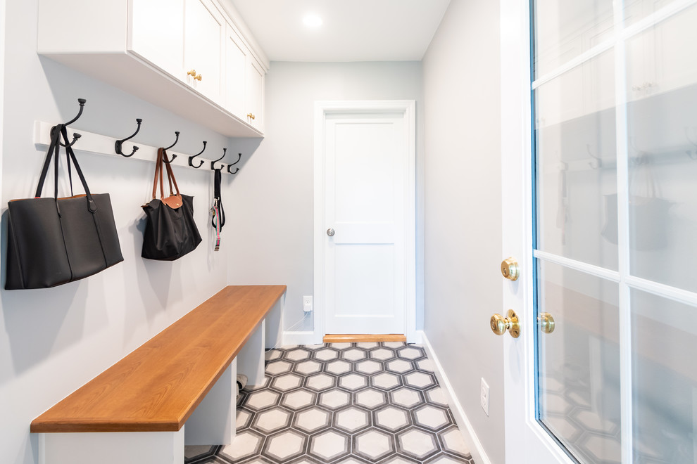 Design ideas for a small transitional mudroom in Philadelphia with grey walls, concrete floors, a single front door, a white front door and multi-coloured floor.