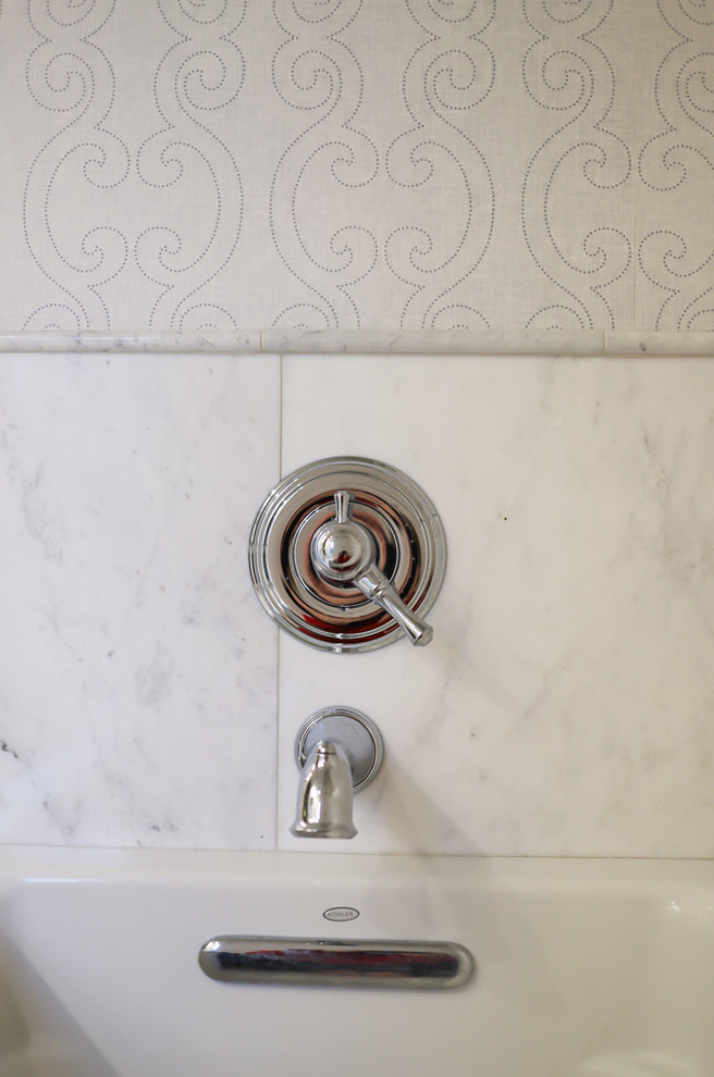 Example of a mid-sized transitional master white tile and marble tile ceramic tile and gray floor alcove bathtub design with gray walls, beaded inset cabinets, white cabinets, a two-piece toilet, an undermount sink, quartzite countertops and a hinged shower door