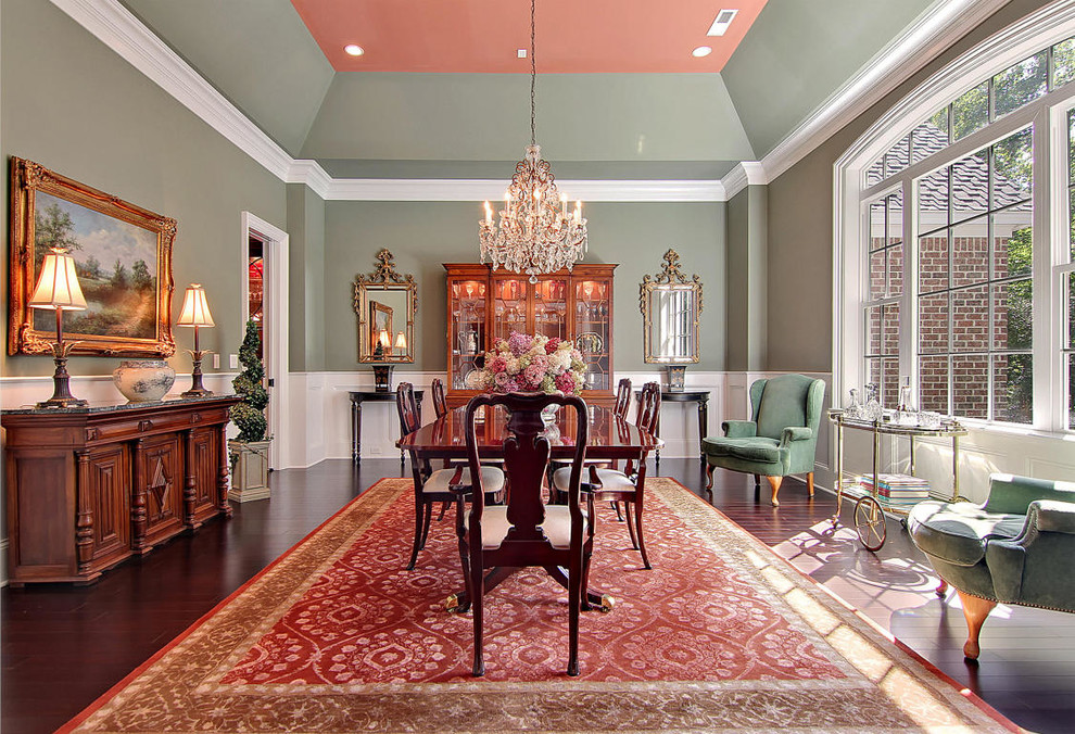 This is an example of a traditional separate dining room in Charleston with grey walls.