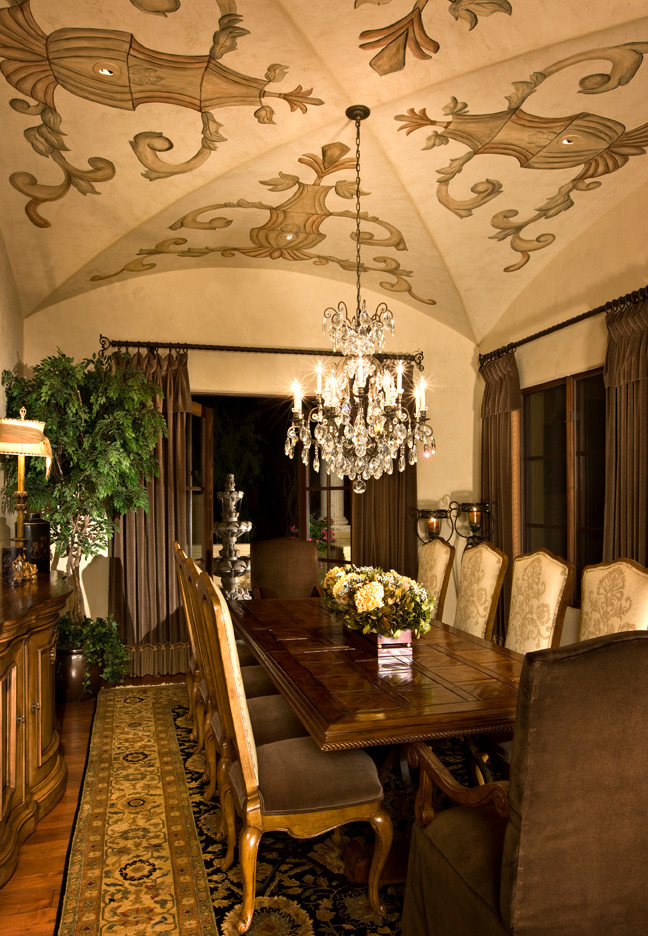Inspiration for a mid-sized mediterranean separate dining room in Phoenix with beige walls and medium hardwood floors.