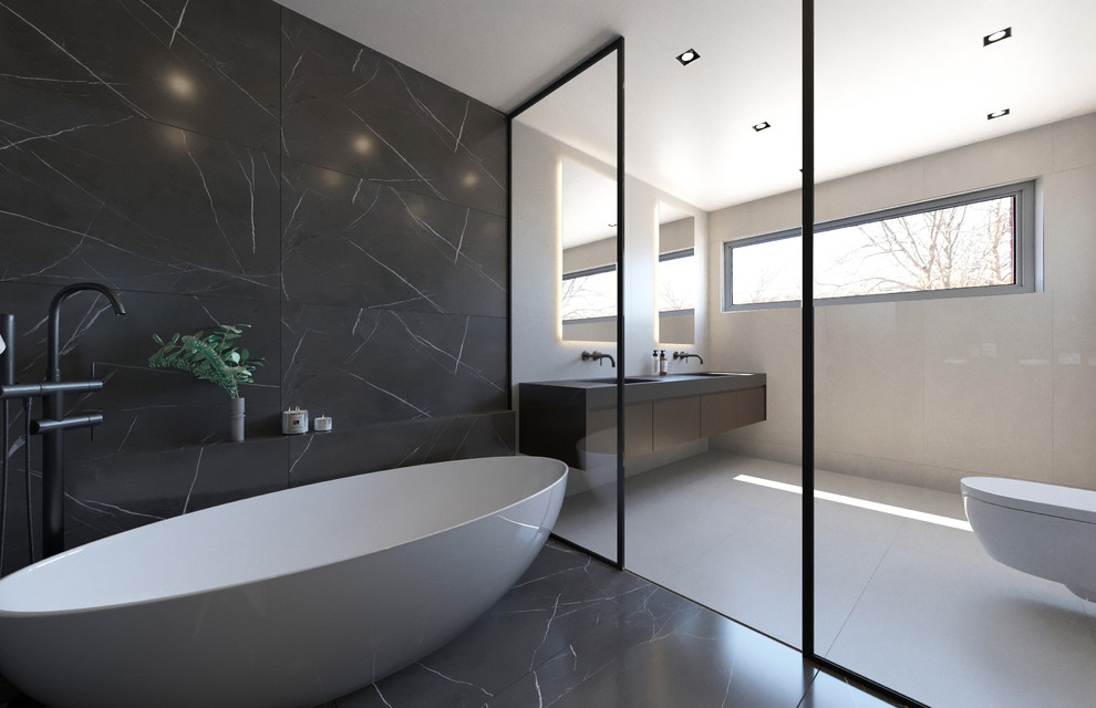 This is an example of a large modern master bathroom in Montreal with flat-panel cabinets, brown cabinets, a freestanding tub, a curbless shower, a wall-mount toilet, gray tile, porcelain tile, grey walls, porcelain floors, an undermount sink, solid surface benchtops, grey floor, an open shower and black benchtops.