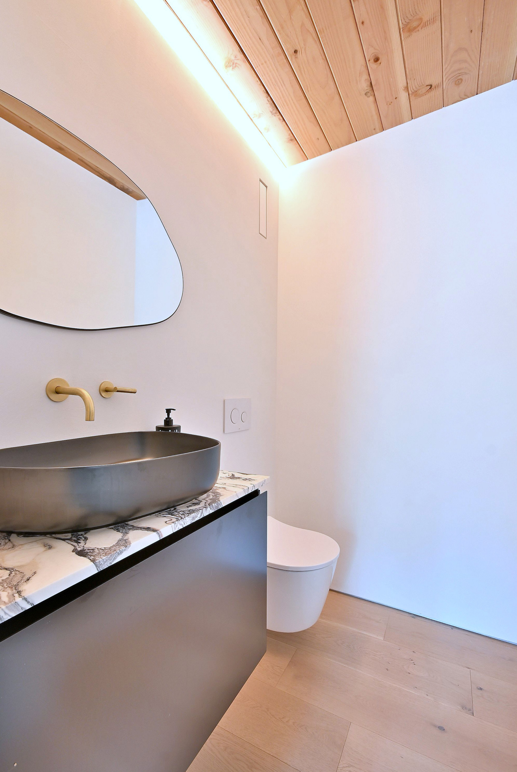Mid-Century Modern Powder Room with Wood Ceiling