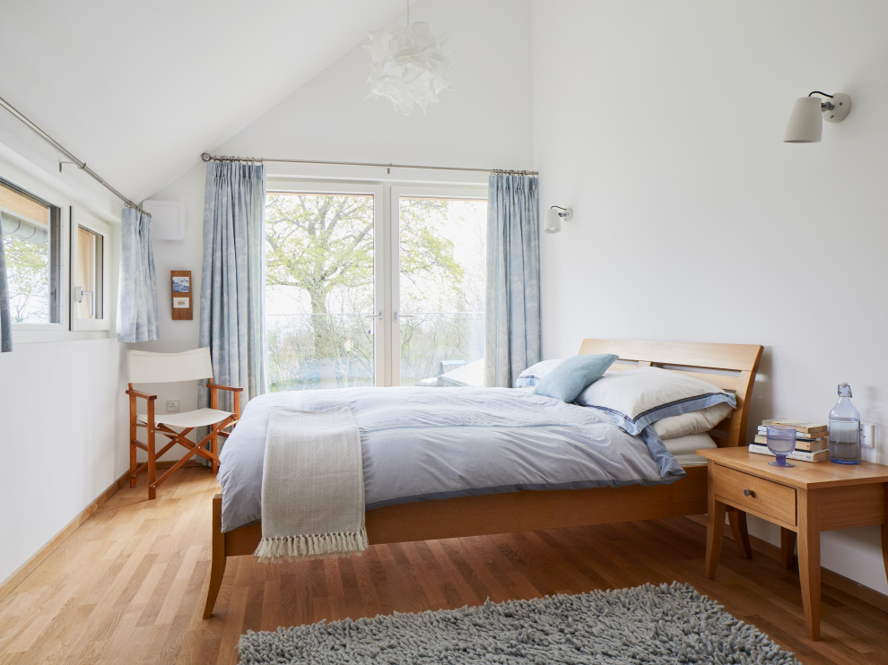 This is an example of a country bedroom in Hampshire.