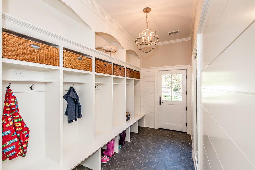 Design ideas for a large country mudroom in DC Metro with beige walls, ceramic floors, a single front door and a white front door.