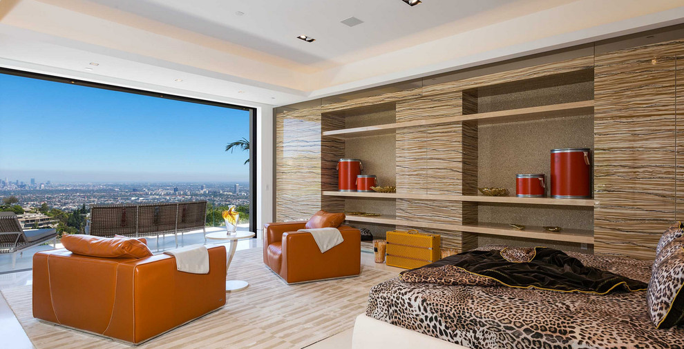 Photo of a large contemporary master bedroom in Los Angeles with marble floors and a wood fireplace surround.