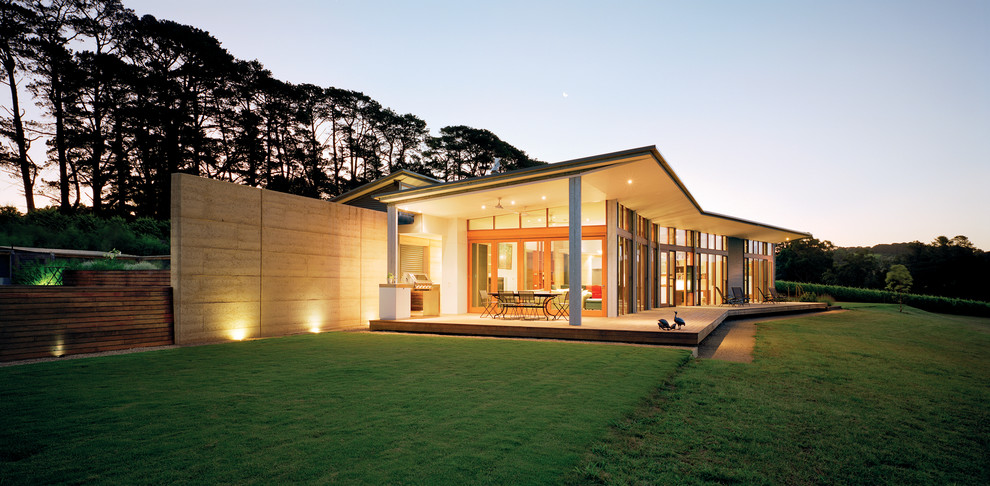 Design ideas for a large modern split-level exterior in Melbourne with mixed siding and a shed roof.