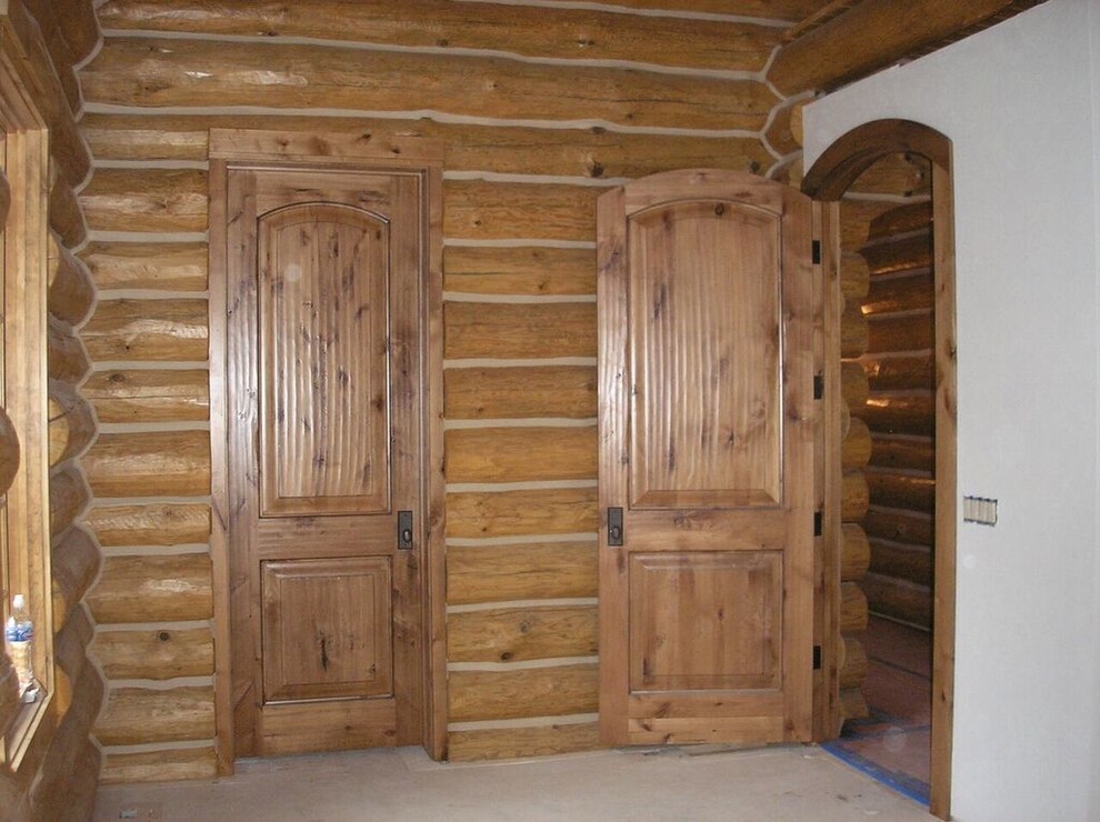 Inspiration for a large rustic entry hall remodel in Chicago with a light wood front door