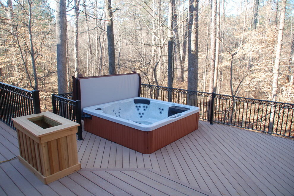Design ideas for a large backyard deck in Raleigh with a water feature.