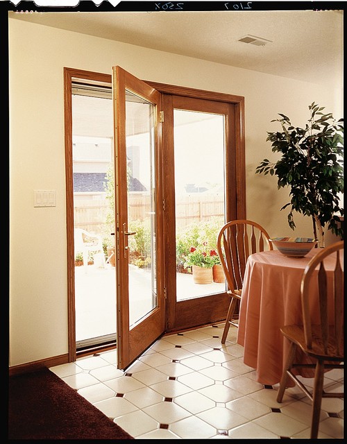 Pella® ProLine® ENERGYSTAR®qualified hinged patio doors Traditional Dining Room Cedar