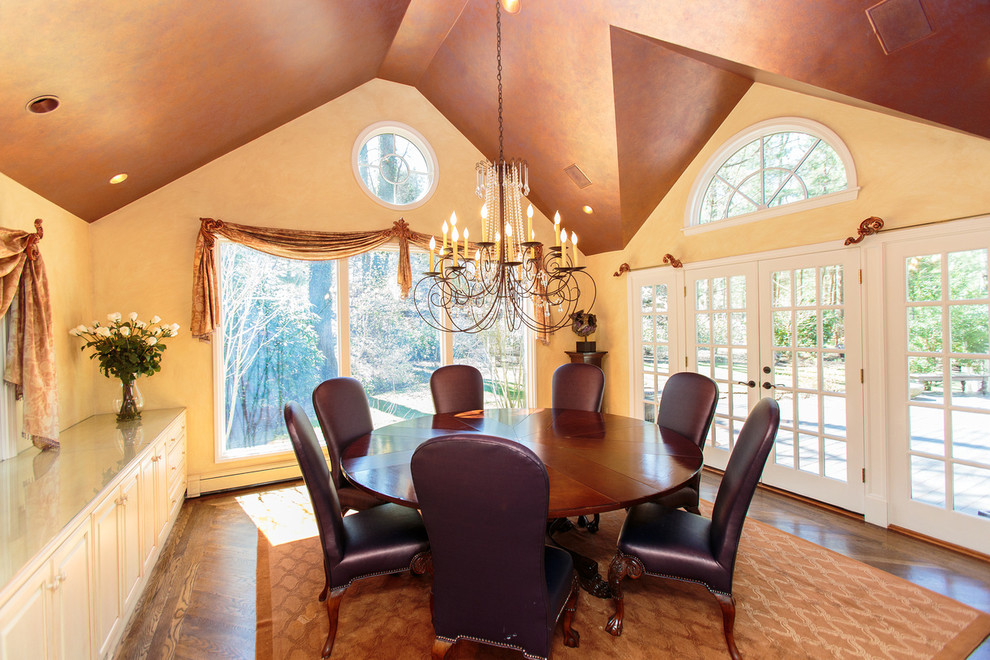 This is an example of a traditional dining room in Boston with medium hardwood floors.