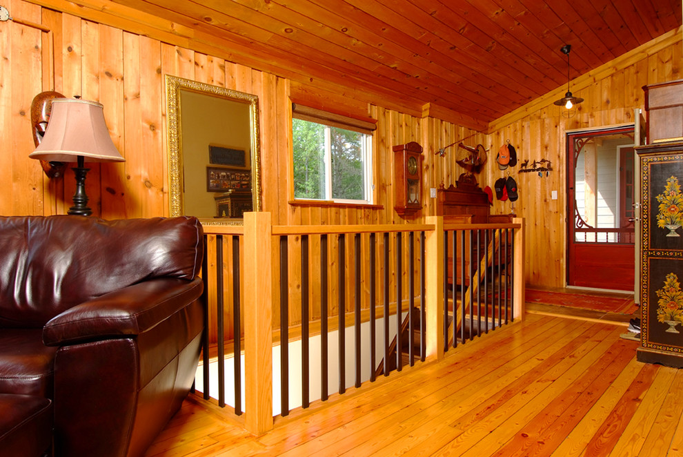 Staircase - mid-sized rustic wooden l-shaped light wood floor staircase idea in Toronto with brown walls and wooden risers