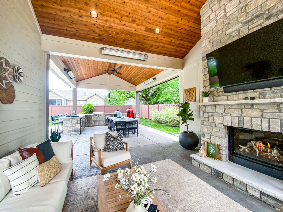 PoolSide Covered Patio with a Fireplace and Outdoor Kitchen Patio St Louis by Heartlands