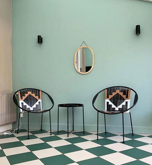 Photo of a mid-sized modern dining room in Lille with ceramic floors and turquoise floor.