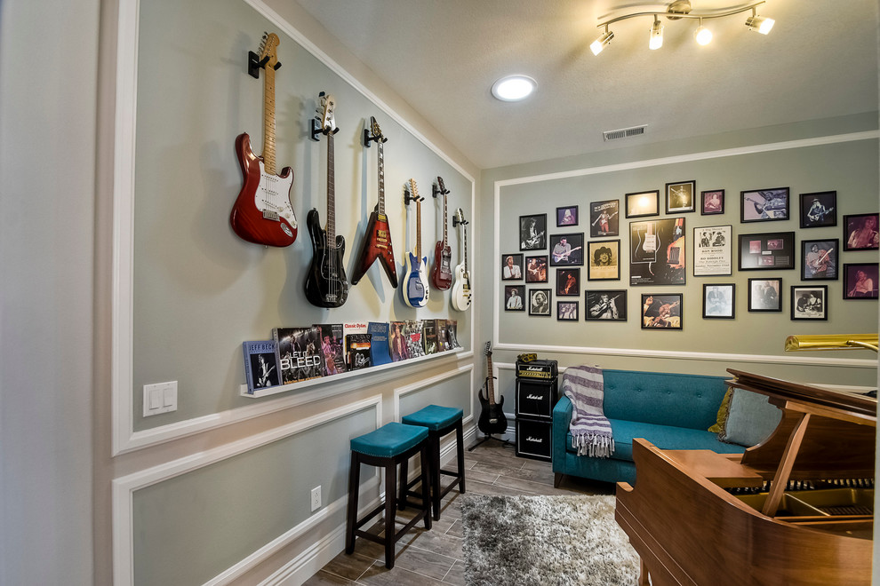 This is an example of a mid-sized contemporary enclosed family room in San Diego with a music area, blue walls, dark hardwood floors, no fireplace and no tv.