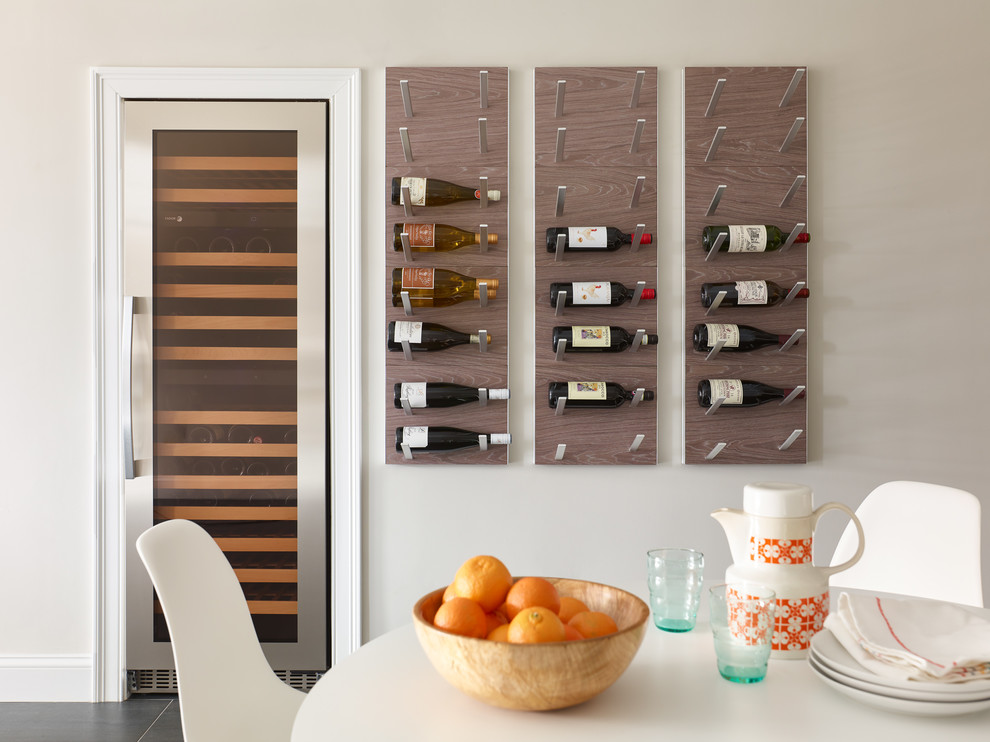 Design ideas for a mid-sized contemporary wine cellar in Boston with porcelain floors, storage racks and grey floor.