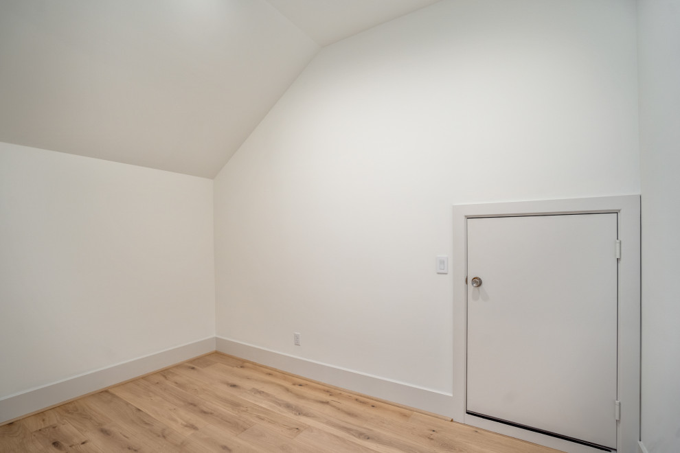 Closet - mid-sized transitional light wood floor closet idea in Houston