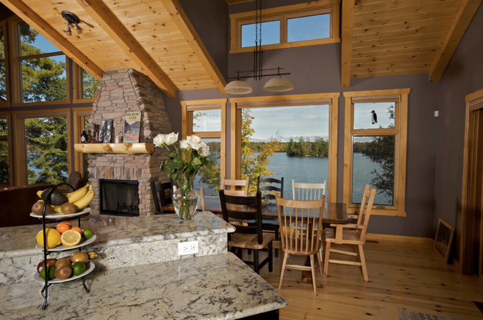 Large mountain style galley dark wood floor open concept kitchen photo in Boston with an undermount sink, shaker cabinets, white cabinets, granite countertops, stainless steel appliances and an island