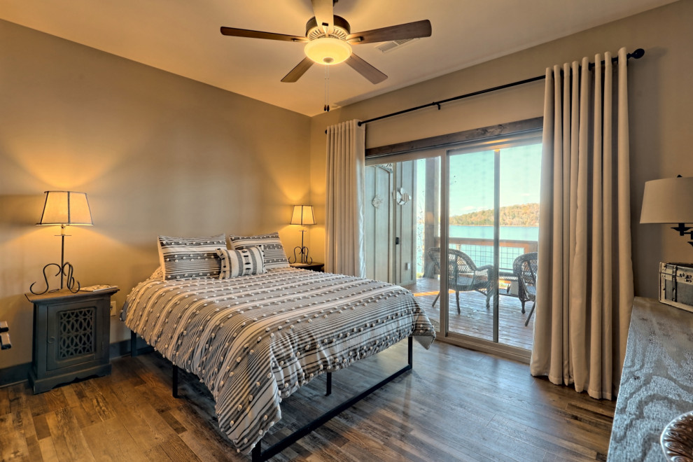 This is an example of a mid-sized arts and crafts guest bedroom in Atlanta with grey walls, medium hardwood floors and grey floor.
