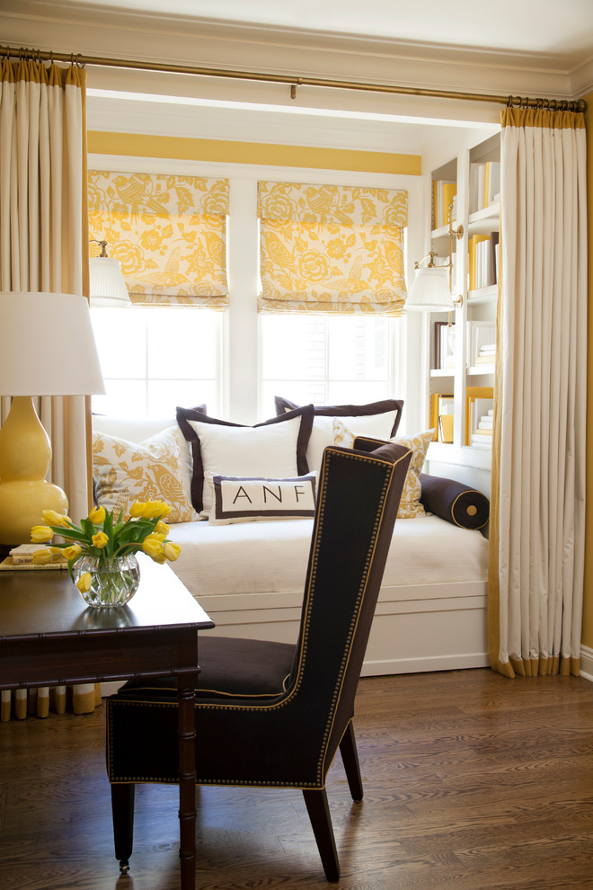 Transitional master bedroom in Little Rock with yellow walls and dark hardwood floors.