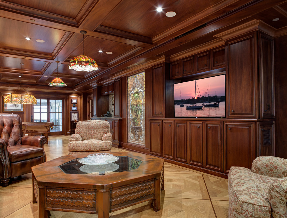 Inspiration for a large traditional enclosed home theatre in Jacksonville with light hardwood floors and a built-in media wall.