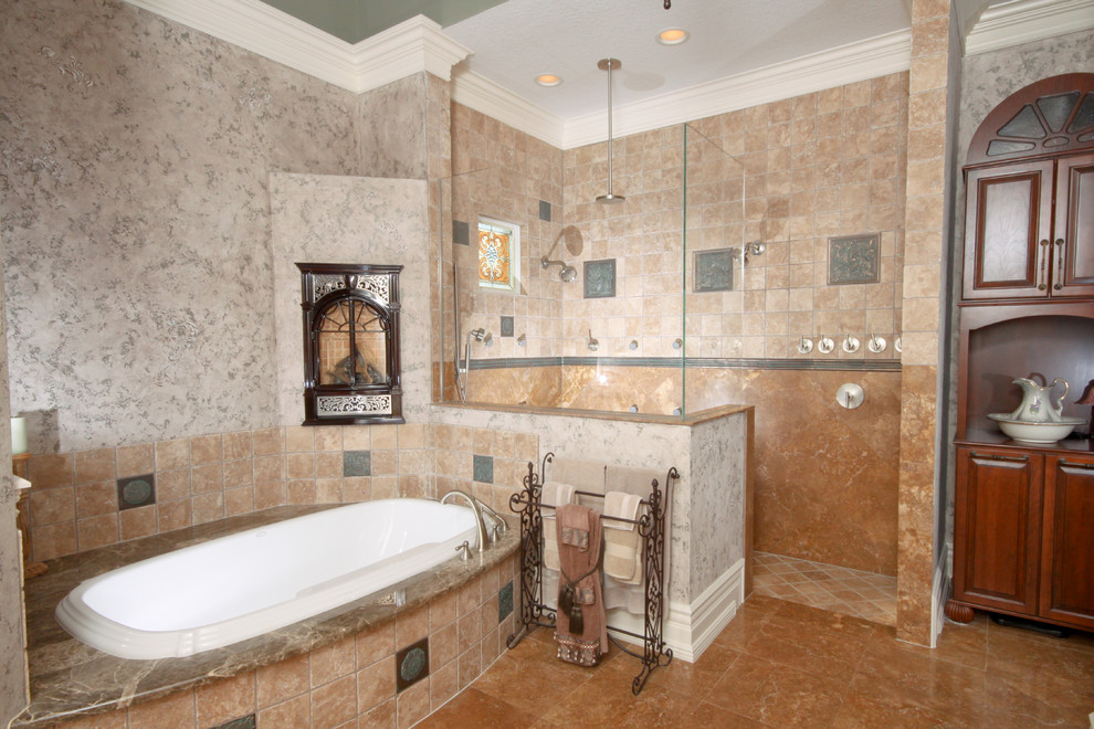 Transitional bathroom in Orlando with raised-panel cabinets, medium wood cabinets, a drop-in tub, a corner shower, beige tile, ceramic tile, beige walls, porcelain floors, an undermount sink, soapstone benchtops, beige floor and an open shower.