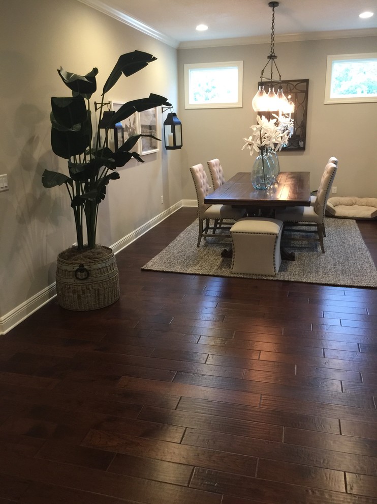 Mid-sized traditional open plan dining in Tampa with dark hardwood floors, no fireplace, brown floor and grey walls.