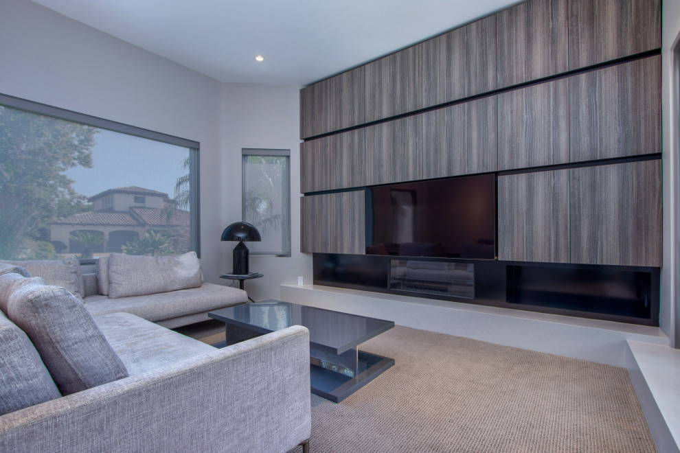Design ideas for a medium sized contemporary games room in San Diego with grey walls, carpet, a ribbon fireplace, a metal fireplace surround, a built-in media unit and panelled walls.