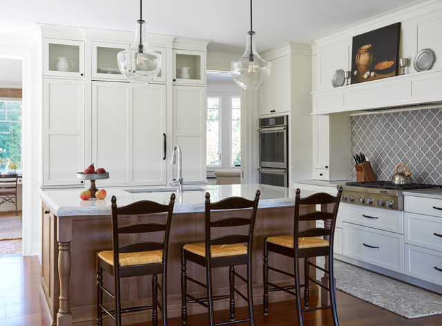 Farmhouse Kitchen With Brown Island And White Perimeter Cabinets