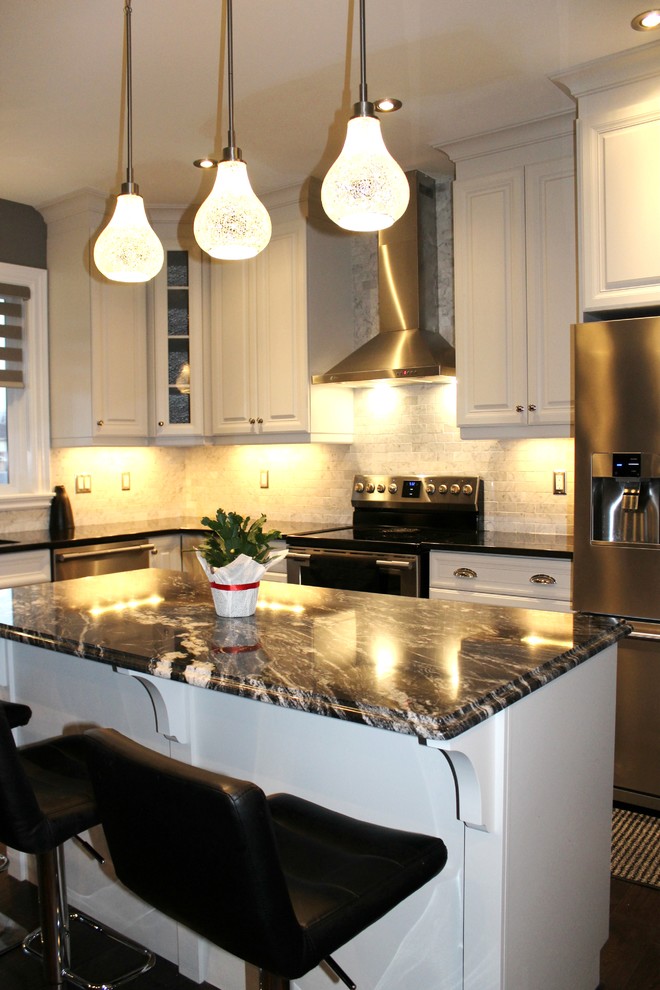 Example of a mid-sized transitional l-shaped dark wood floor open concept kitchen design in Toronto with an undermount sink, raised-panel cabinets, white cabinets, quartzite countertops, gray backsplash, subway tile backsplash, stainless steel appliances and an island