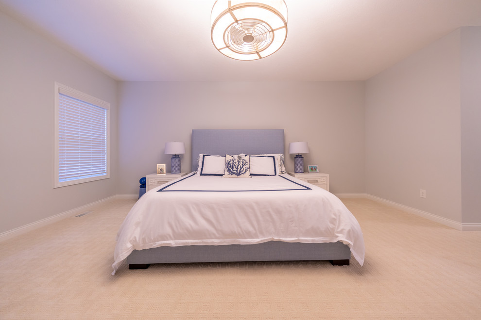 Example of a transitional bedroom design in Cleveland
