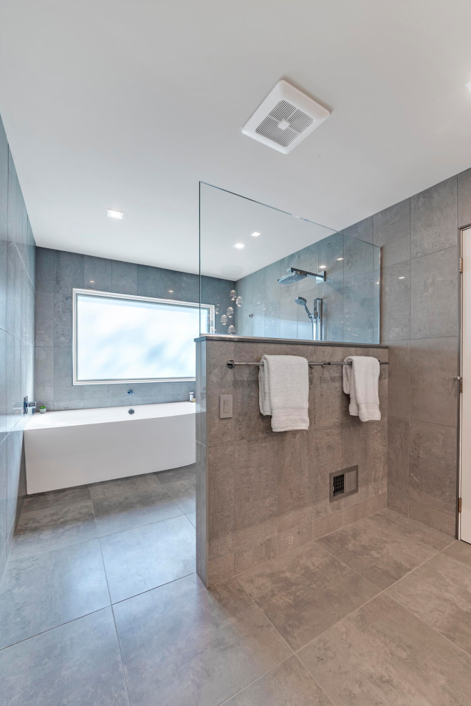 Inspiration for a large modern master gray tile and glass tile ceramic tile, beige floor and double-sink bathroom remodel in Columbus with flat-panel cabinets, brown cabinets, a bidet, multicolored walls, a vessel sink, quartz countertops, multicolored countertops and a floating vanity