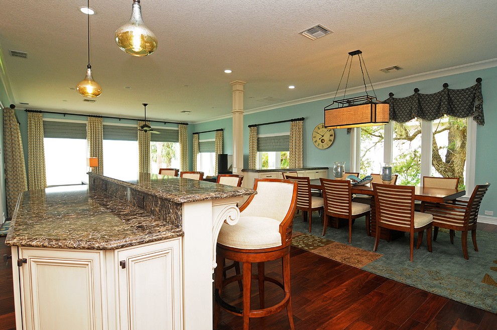 Design ideas for a large transitional kitchen/dining combo in Tampa with blue walls, dark hardwood floors and no fireplace.