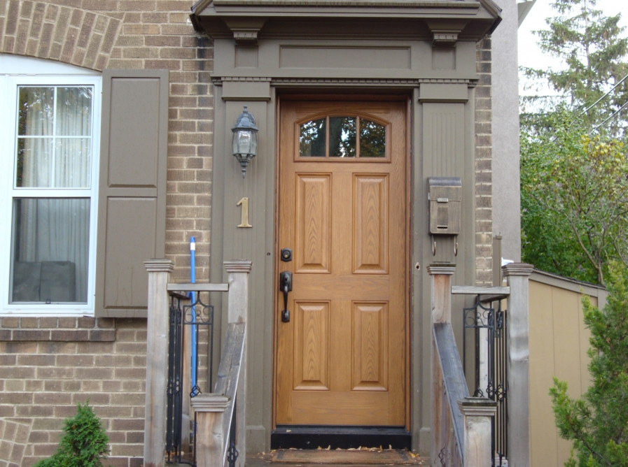 Single front door - single front door idea in Toronto with a medium wood front door
