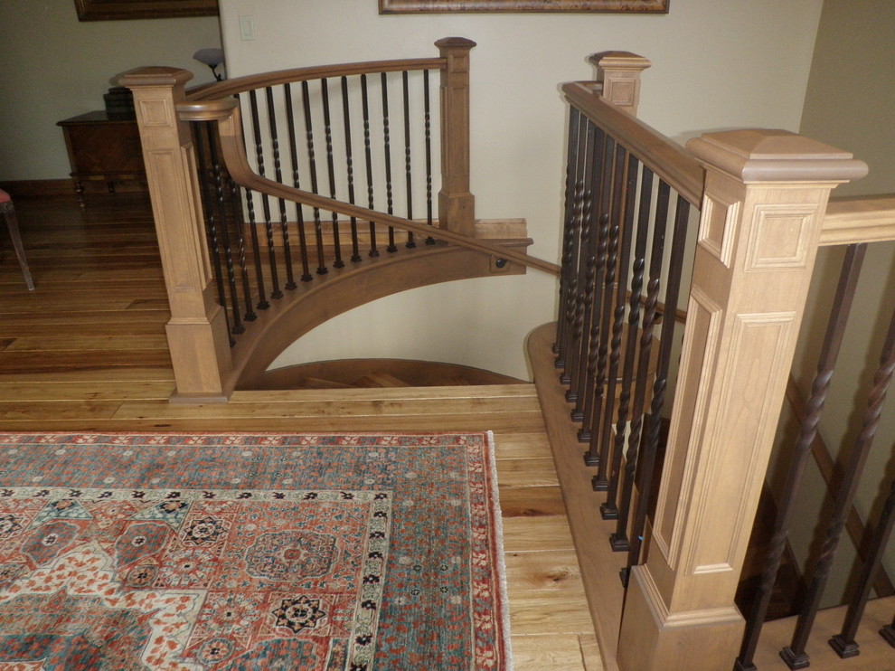 Inspiration for a small country wood spiral staircase in Salt Lake City with wood risers and wood railing.