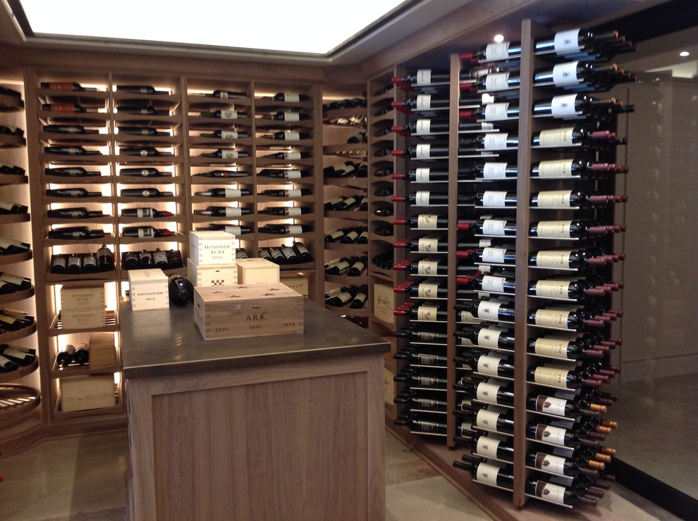 Wine cellar - large transitional wine cellar idea with display racks