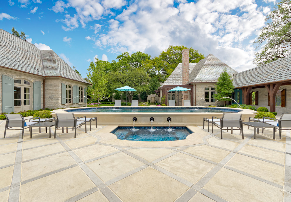 Design ideas for a traditional courtyard pool in Dallas with a water feature.