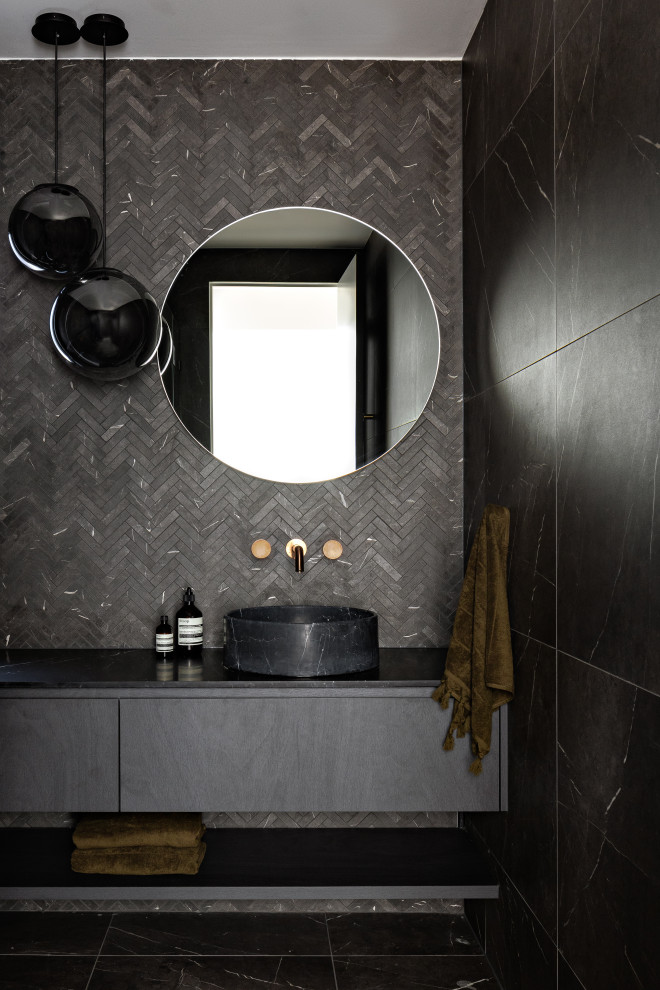 This is an example of a large modern 3/4 bathroom in Sydney with black cabinets, a double shower, black and white tile, marble benchtops, black benchtops, a single vanity and a built-in vanity.
