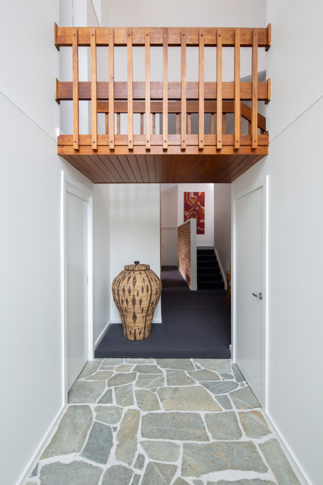Photo of a mid-sized contemporary entryway in Canberra - Queanbeyan.