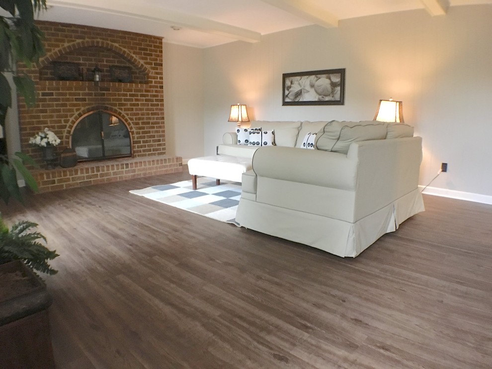 Living room - mid-sized traditional formal and enclosed vinyl floor living room idea in San Diego with beige walls, a standard fireplace, a brick fireplace and no tv